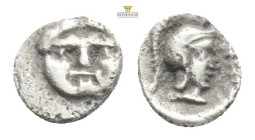 Pamphylia, Aspendus (ca. 4th century BC) AR obol 
Obv: Head of gorgoneion facing with protruding tongue
Rev: Head of Athena right, wearing crested Att...