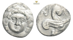 Cilicia, Uncertain AR Obol. 4th century BC. Gorgoneion facing, wearing triple-pendant earrings / Sphinx seated left. SNG France 479; SNG Levante 250 0...