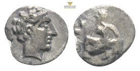 Cilicia, Tarsos, Tiribazos, satrap of Lydia (388-380 BC) AR Obol 
Obv: Female kneeling left, casting astragaloi.
Rev: Head of a youthful male to right...
