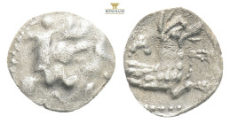 LYCAONIA. Laranda. Obol (4th century BC).
Obv: Baaltars seated left, holding grain ear, grapes and sceptre.
Rev: Forepart of wolf right; crescent abov...