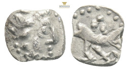 LYCAONIA. Laranda. Obol (4th century BC).
Obv: Baaltars seated left, holding grain ear, grapes and sceptre.
Rev: Forepart of wolf right; crescent abov...