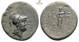 CILICIA. Soloi. Circa 100-30 BC. . Head of Athena to right, wearing crested Corinthian helmet. 
Rev. ΣOΛEΩN Bearded Dionysos standing facing, with bul...