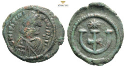 Justinian I. AD 527-565. Antiochia
Pentanummium Æ
Diademed, draped, and cuirassed bust right / Large Є with central cross; star to right. 2g 19,3mm