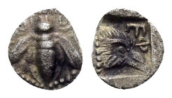 IONIA. Ephesos.(Circa 500-420 BC).Tetartemorion.

Obv : Bee; annulet to left and right.

Rev : Ε Φ.
Head of eagle right in incuse square.
SNG Kayhan 1...
