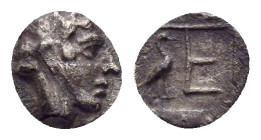 IONIA. Kolophon. (Circa 450-410 BC).Tetartemorion.

Obv : Laureate head of Apollo right.

Rev : TE.
Monogram (mark of value) in incuse square; stork i...