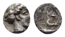 IONIA. Kolophon.(Circa 450-410 BC).Tetartemorion.

Obv : Laureate head of Apollo right; symbol behind head.

Rev : TE.
Monogram (mark of value) in inc...