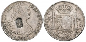 Carlos IV (1788-1808). 8 reales. 1808. México. TH. (Cal-709). Ag. 26,89 g. Resello escudo de Portugal (De Mey-1040). Escasa. MBC+. Est...200,00.