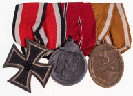 Ordenspangen 3. Reich 2. Weltkrieg
 Ordensspange mit Eisernes Kreuz 1939 2. Klasse, Ostmedaille und Schutzwall-Ehrenzeichen, Zustand 2.