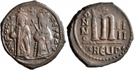 Phocas, 602-610. Follis (Bronze, 27 mm, 10.10 g, 11 h), with Leontia, Theoupolis (Antiochia), RY 4 = 605/606. O N FOCA NЄ PЄ AV Phocas standing facing...