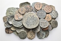 A lot containing 54 bronze coins. Includes: Byzantine, Arab-Byzantine, Crusaders and Islamic. Fine to very fine. LOT SOLD AS IS, NO RETURNS. 54 coins ...