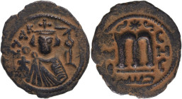 Islamic: Umayyad Caliphate 'Abd al-Malik ibn Marwan AH 65-86 = AD 685-705 Bronze Fals Very Fine; earthen brown patina