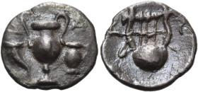 APULIA. Canusium. Circa 300-250 BC. Obol (Silver, 10 mm, 0.44 g, 9 h). Δ-A Amphora; in the field to left, cornucopia; in the field to right, oenochoe....