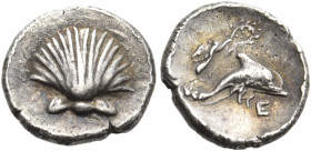 CALABRIA. Tarentum. Circa 325-280 BC. Hemilitron (Silver, 8 mm, 0.34 g, 11 h). Cockle shell. Rev. Dolphin leaping right; above, Nike flying right, cro...