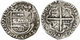1598/7. Felipe II. Valladolid. . 1 real. (Cal. 695 var). 3,46 g. Tipo "OMNIVM". Fecha en reverso. Sin gráfila circular en reverso. Rara. MBC-.