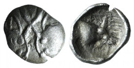 Caria, Uncertain, c. 5th century BC. AR Tetartemorion (6mm, 0.12g, 6h). Confronted bull heads. R/ Forepart of bull r., within incuse square. Cf. SNG K...