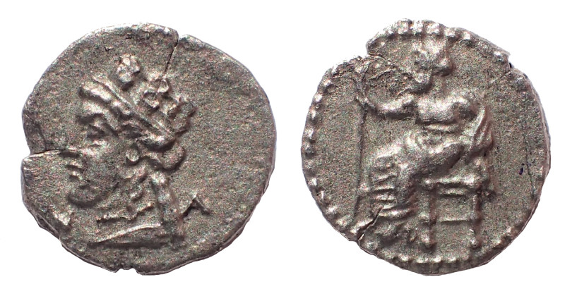 Cilicia, Nagidos.Circa 400-380 BC. AR Obol. 10 mm. 0.7 gm. Obv: Baal seated left...