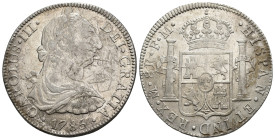 CARLOS III. 8 reales. 1786. México. FM. AR 26,87 g. 38,5 mm. VI-951. Rayas en anv. Rotura de cuño en rev. MBC.