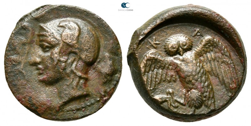 Sicily. Kamarina 420-405 BC. 
Tetras or Trionkion Æ

15mm., 3,50g.

Helmete...