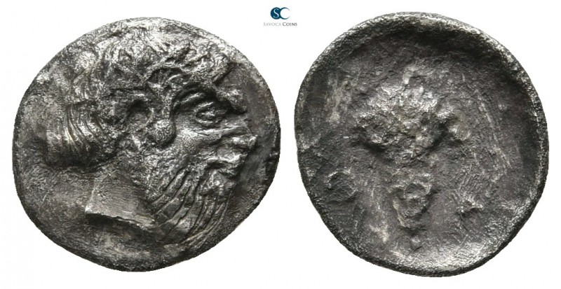 Sicily. Naxos circa 460-420 BC. 
Litra AR

10mm., 0,59g.

Wreathed head of ...