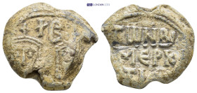 Byzantine Lead Seal (24mm, 11.98 gr) Obv: Crowned and draped facing imperial busts Rev: Legends in four lines.