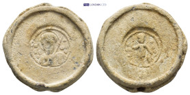 Byzantine Lead Seal (23mm, 14.55 gr) Obv: Bust of St. Theodore holding a spear and shield. Rev: Saint, standing facing, nimbate, holding spear in his ...