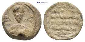 Byzantine Lead Seal (15mm, 4.39 gr) Obv: Bust of Saint holding gospel. Rev: Legend four lines.