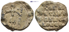 Byzantine Lead Seal (27mm, 16.15 gr) Obv: St. George(?) standing facing, holding spear and shield; legend around. Rev: Legend four lines.
