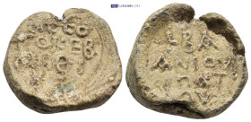 Byzantine Lead Seal (24mm, 19.84 gr) Obv: Legend four lines. Rev: Legend four lines.