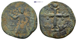 Baldwin II AD 1100-1118. Edessa Follis Æ (20mm, 2.9 g) Latin cross with acanthus at bottom; pellets around. / Baldwin standing left, wearing conical h...