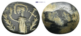A bronze ring part with standing figure holding long cross, palm branches left and right. (15mm, 3.21 g)