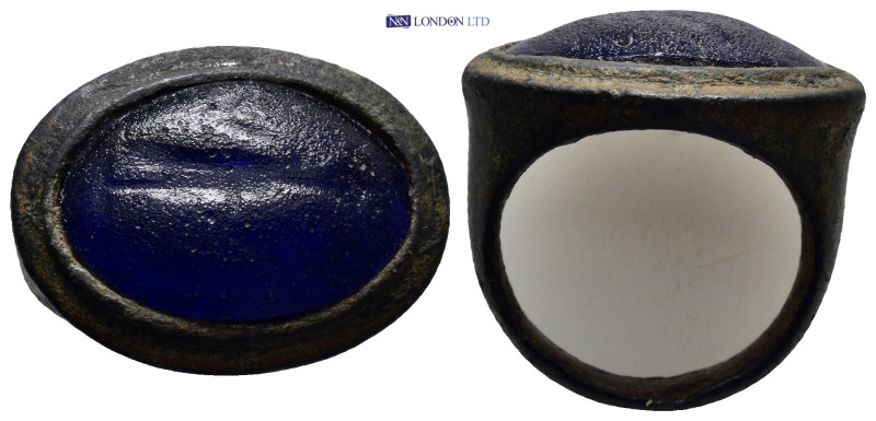 A bronze ring with blue stone. (10mm, 10.89 g)