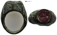 A bronze ring with red stone. (12mm, 14.82 g)