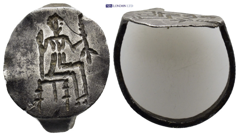 A silver ring. Male figure seated right. (20mm, 3.69 g)