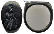 A bronze ring. Male figure standing right. (6mm, 5.0 g)