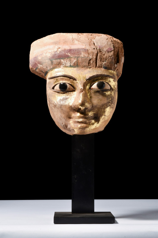 EGYPTIAN GILDED MUMMY MASK

 New Kingdom, Ca. 1550-1069 BC
 A gilded sarcopha...