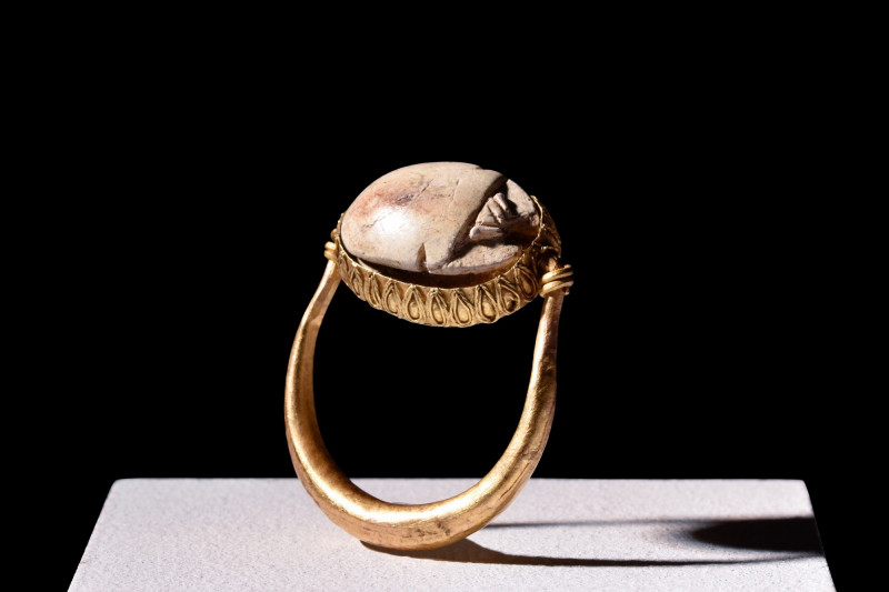 SWIVEL GOLD RING WITH EGYPTIAN SCARAB

 Hyksos Period, Ca. 1630-1523 BC
 A hi...