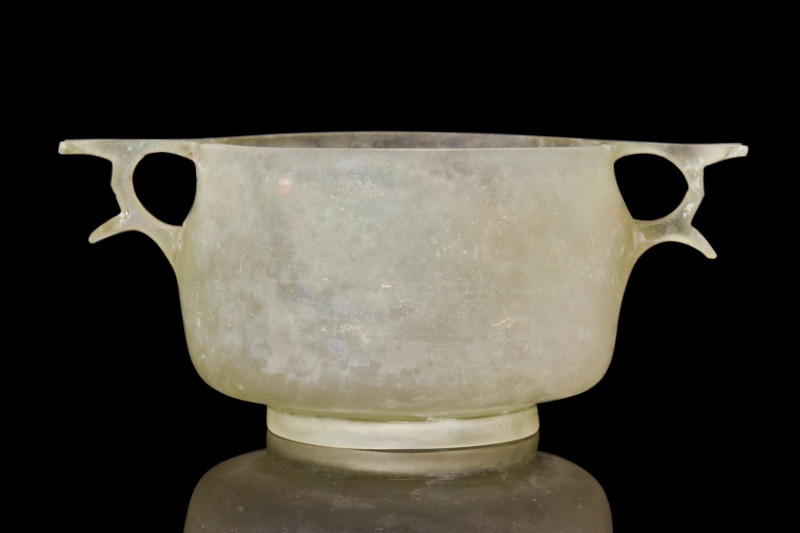 RARE GREEK CUT GLASS SKYPHOS

 Ca. 100-200 BC
 A pale yellow-green in color, ...