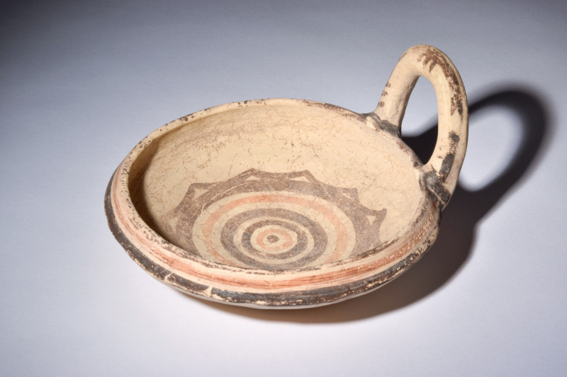 DAUNIAN POTTERY KYATHOS

 Ca. 500 BC
 A terracotta kyathos with a hemispheric...