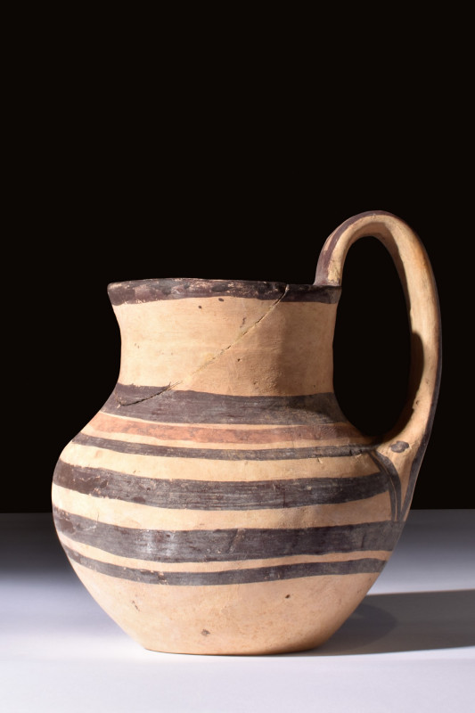 DAUNIAN BICHROME POTTERY JUG

 Magna Graecia, Ca. 500-400 BC
 A pottery jug w...