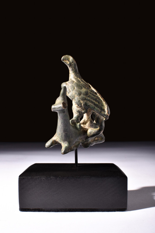 ROMAN BRONZE EAGLE GRASPING A DEER

 Ca. 200-300 AD
 A bronze fitting shows a...