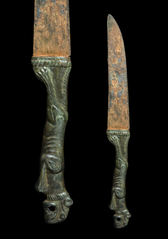 ROMAN IRON KNIFE WITH LION-SHAPED BRONZE HANDLE 

 Ca. 100-200 AD
 An iron kn...