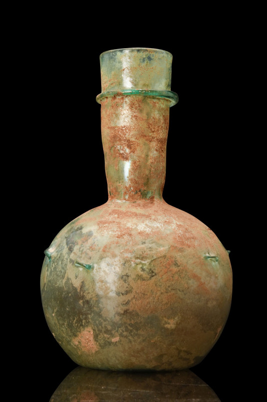 LARGE ROMAN DECORATED GLASS BOTTLE

 Ca. 100-200 AD
 A light blue-green glass...