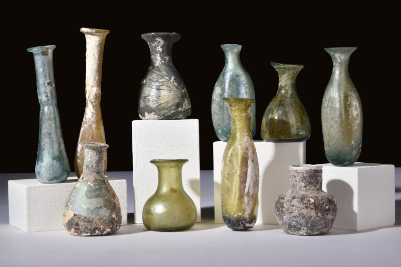 ROMAN COLLECTION OF 10 GLASS VESSELS

 Ca. 100-300 AD
 A set of 10 distinctly...