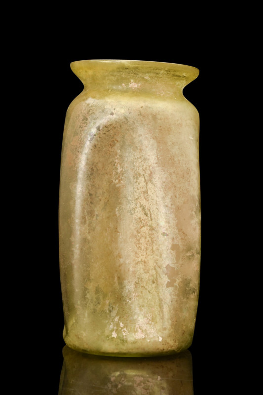 ROMAN SQUARED AND FLUTED JAR

 Ca. 100-200 AD
 A yellow-green blown glass jar...