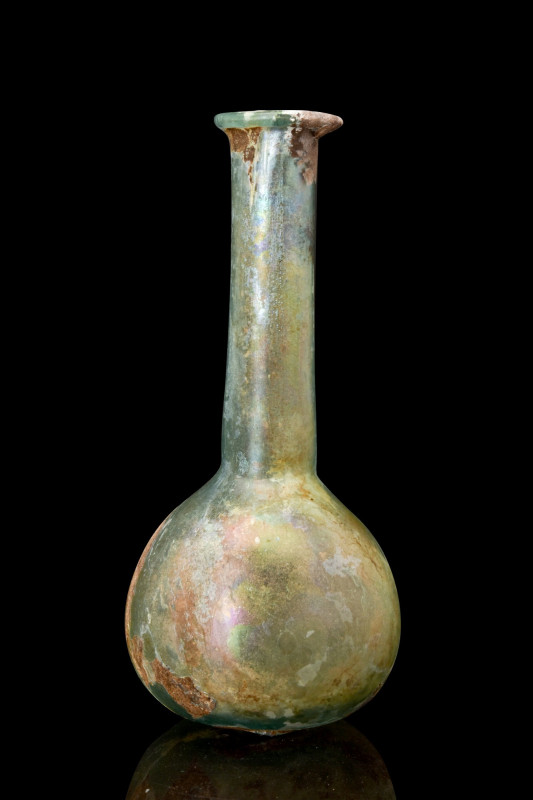 ROMAN GLASS UNGUENTARIUM

 Ca. 100-200 AD
 An elegant blue-green glass unguen...