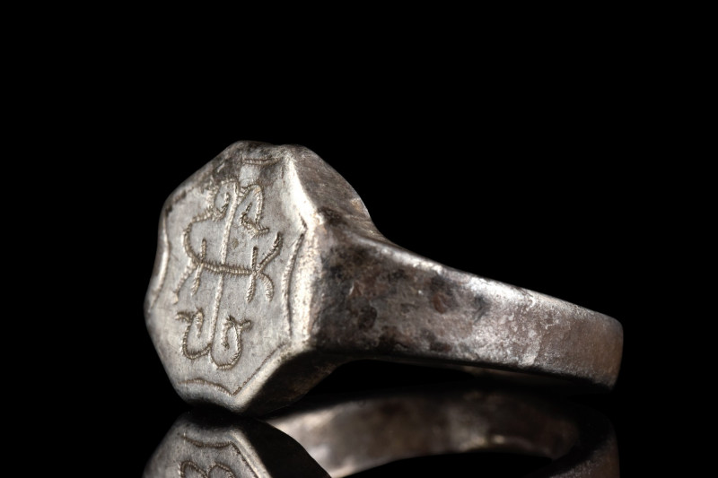 BYZANTINE SILVER RING WITH MONOGRAM

 Ca. 600-800 AD
 A silver ring with a sl...