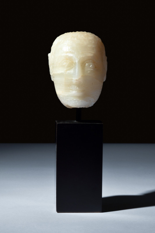 SOUTH ARABIAN ALABASTER HEAD

 Ca. 200 BC-100 AD
 An oval-shaped alabaster he...