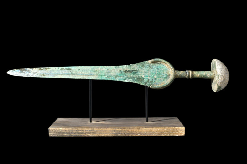 ANCIENT BRONZE SWORD WITH STONE POMMEL

 Western Asiatic/Aegan, ca. 1200-700 B...