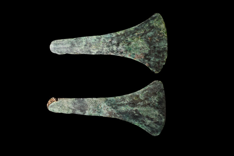 BRONZE AGE PAIR OF FLAT AXE HEADS

 Ca. 2000 BC
 A set of two bronze axe head...