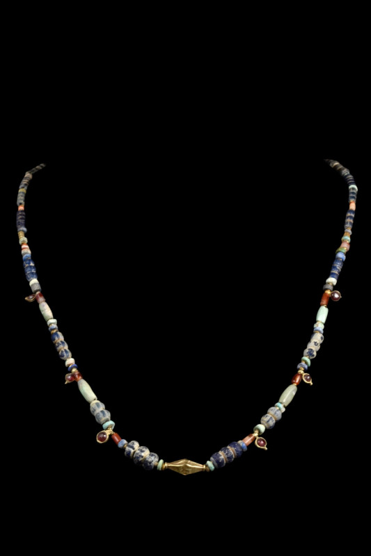 BACTRIAN GOLD AND STONE BEADED NECKLACE

 Ca. 2000-1000 BC
 A necklace with r...